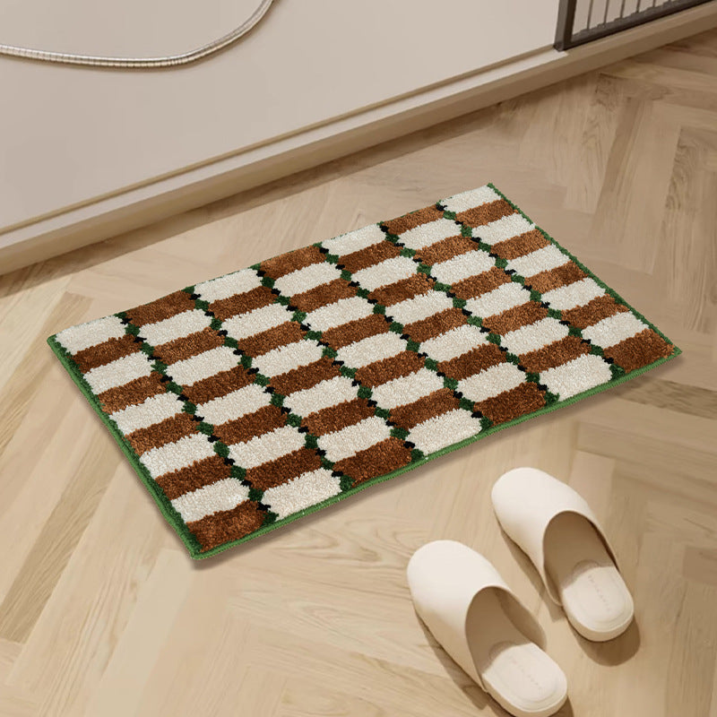 Hand-tufted bathroom mat with a velvety pile, non-slip latex backing, and geometric honeycomb check pattern Stornfield