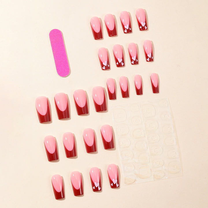 Heart-Patterned Acrylic Nail Art Extensions Stornfield