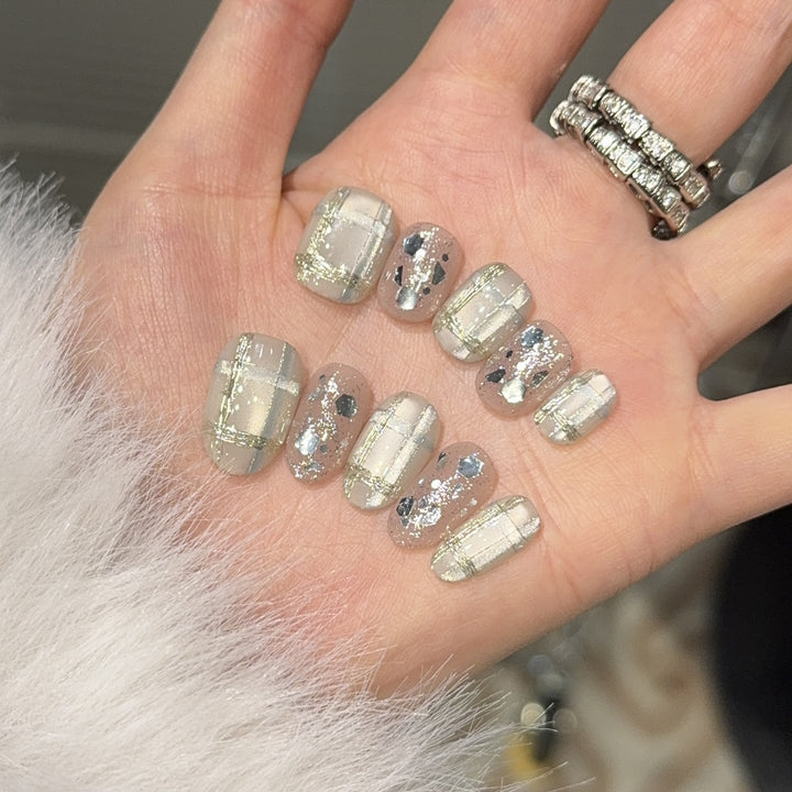 Glamorous artificial nail tips with metallic detail Stornfield