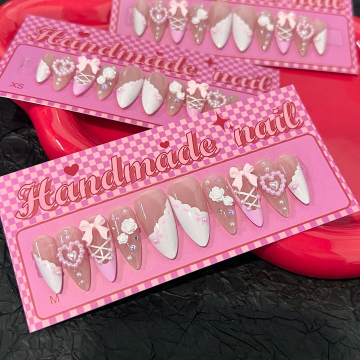 Artful stiletto nails with romantic accents Stornfield