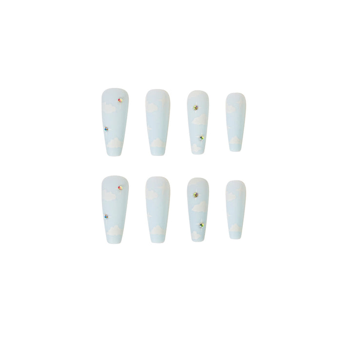 Creative nail art in cloud design with glitter accents Stornfield