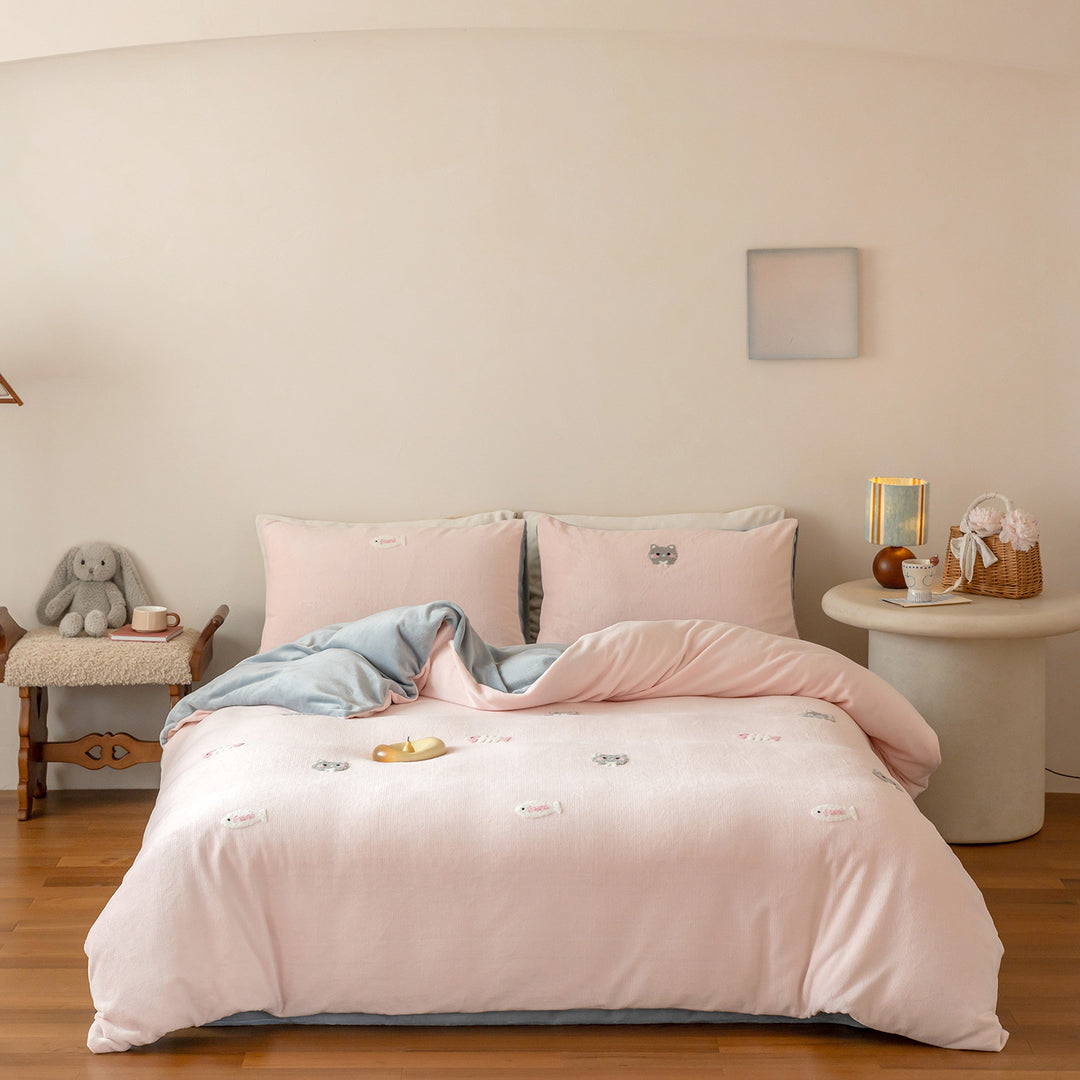 Cozy cotton bedding set with pom-pom appliques and embroidered lettering