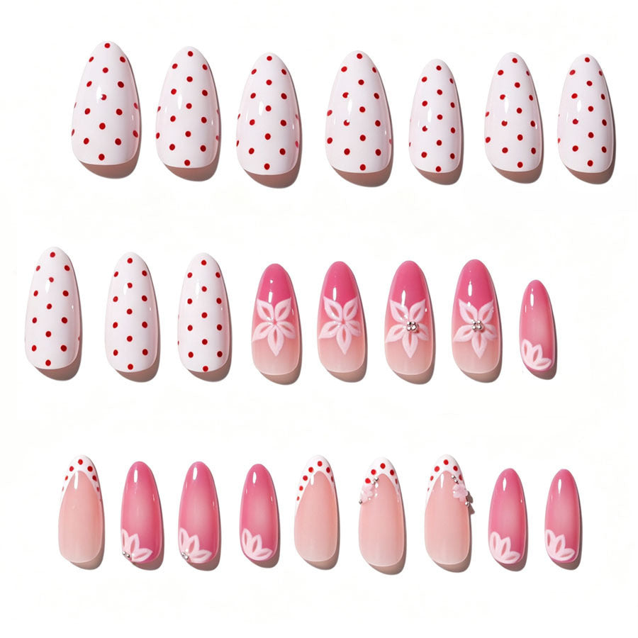 Artificial nail set with floral accents and charming polka dots Stornfield
