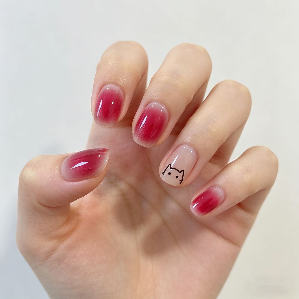 Artificial nails with elegant ombre effect and playful cat design Stornfield