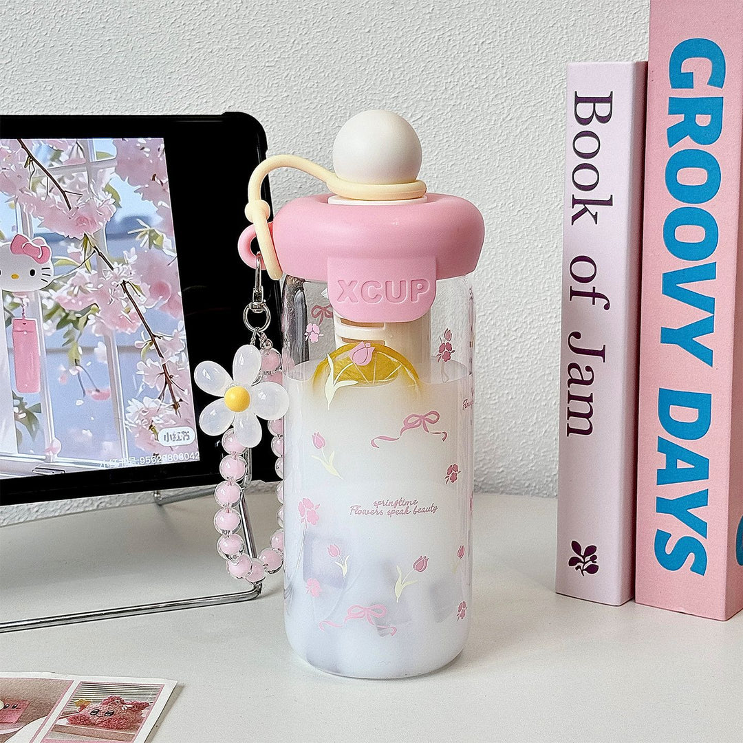 Women's bottle with integrated fruit infuser and Stornfield keychain