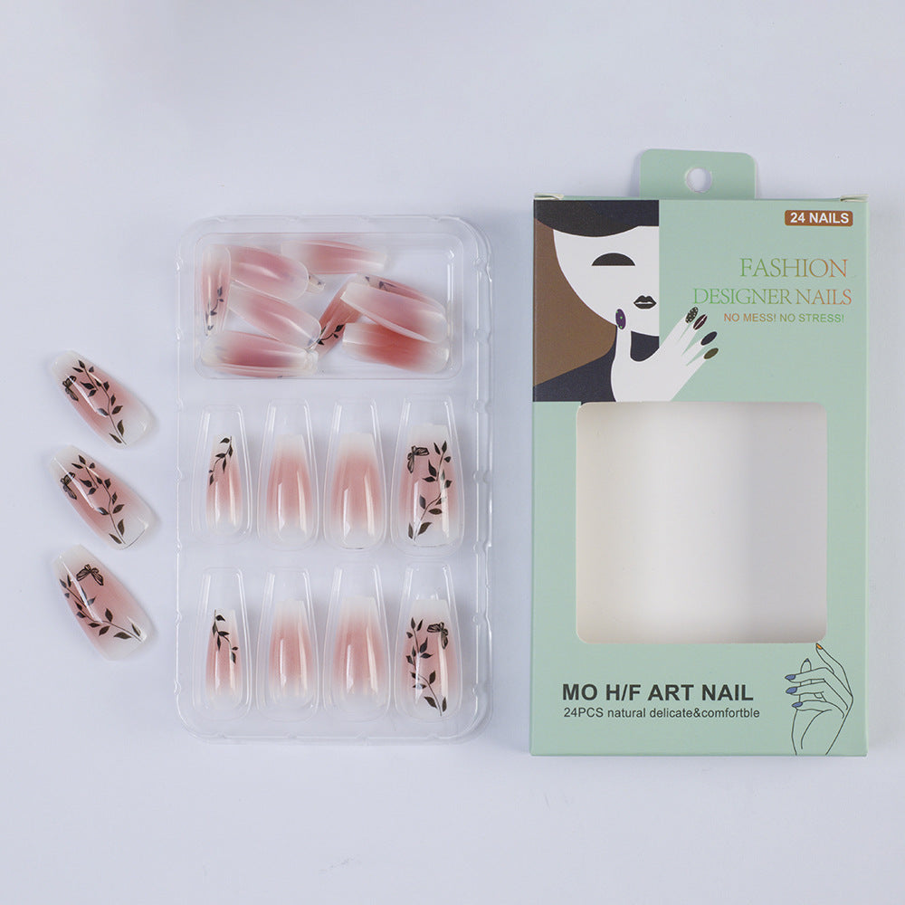 Press-on nails in elegant ombre design with floral accents Stornfield
