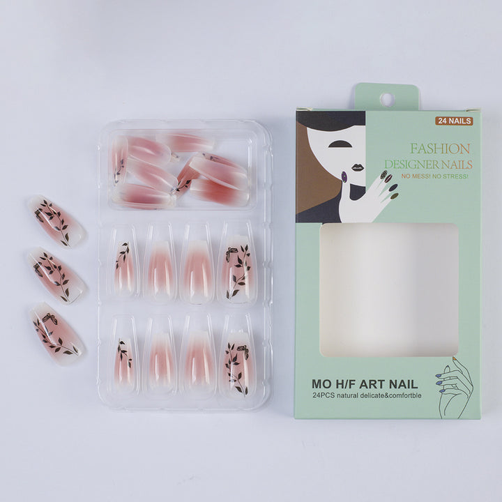 Press-on nails in elegant ombre design with floral accents Stornfield