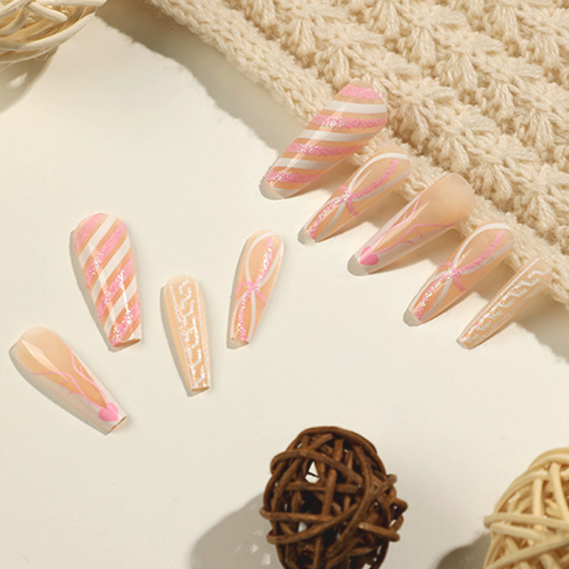 Translucent artificial nails with delicate patterns Stornfield