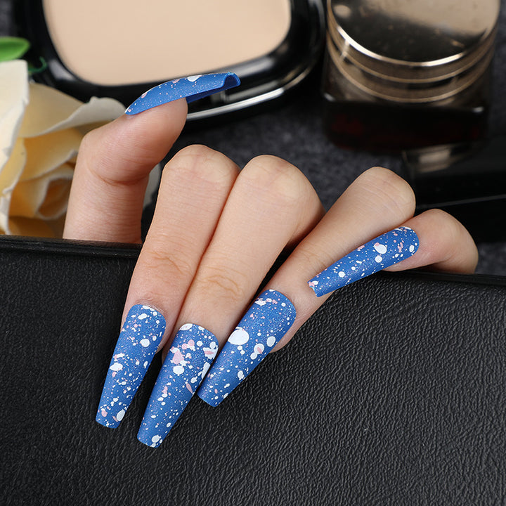 Artistic splatter design artificial nails Stornfield