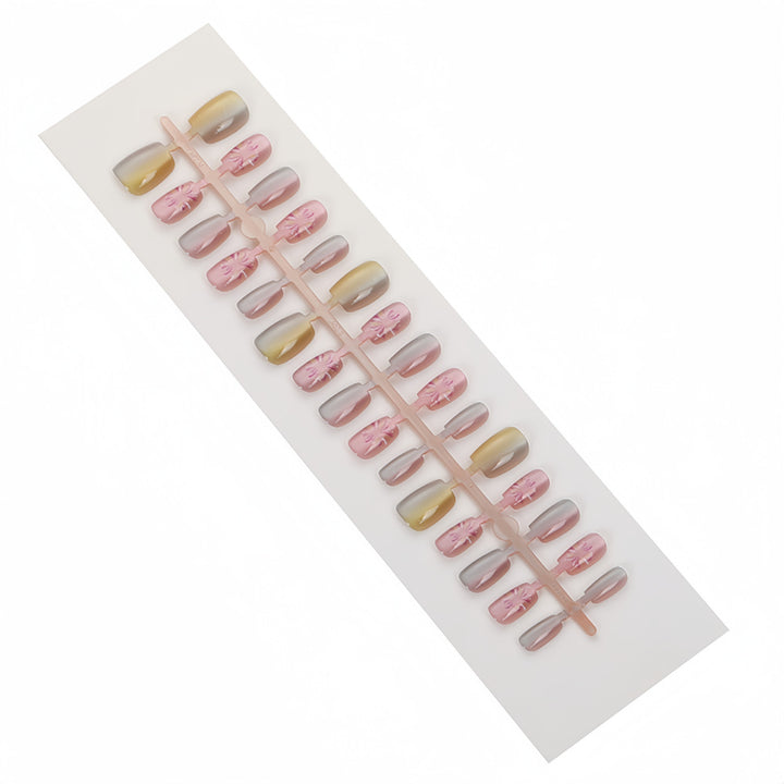 Artificial nails in modern ombre design with floral accents Stornfield