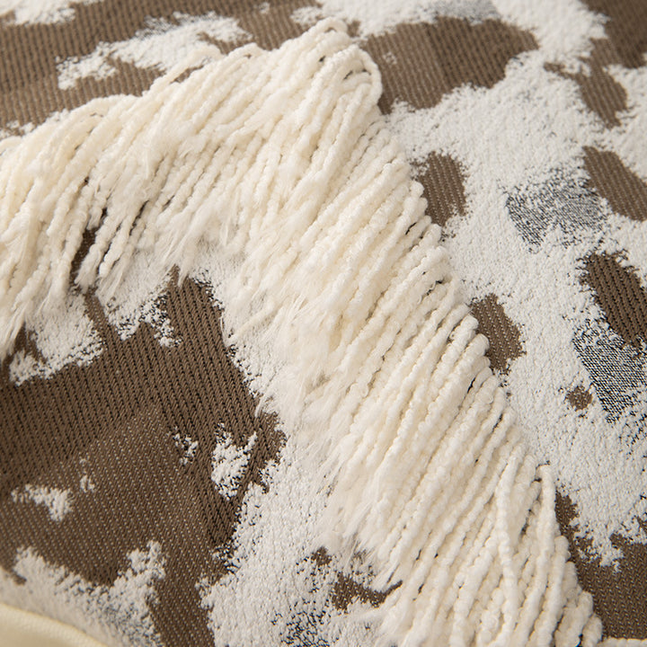 Woven square decorative cushion with fringe application and geometric pattern