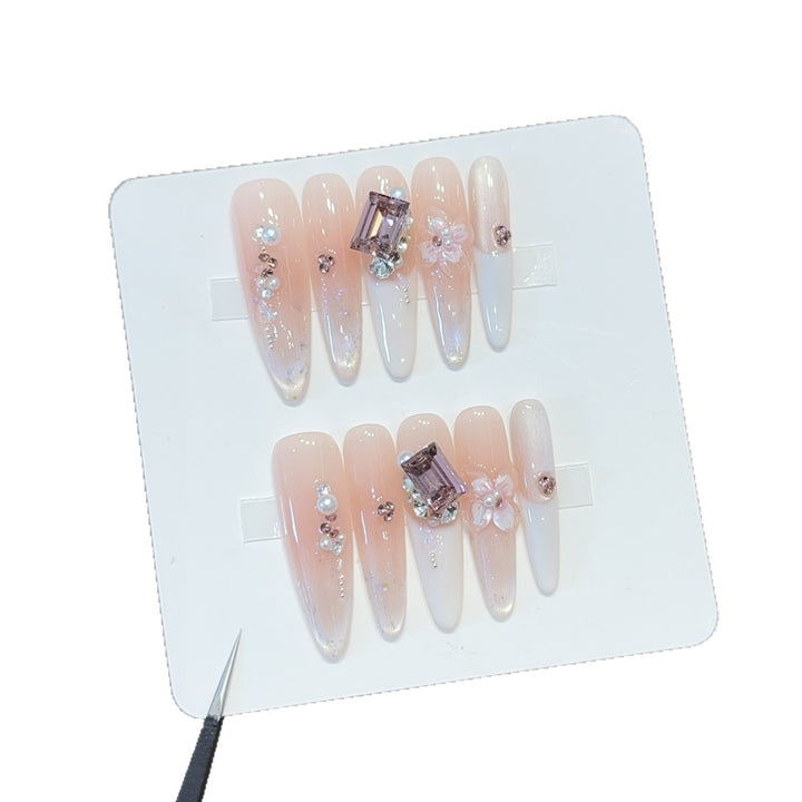 Artificial nails with elegant jewelry details Stornfield