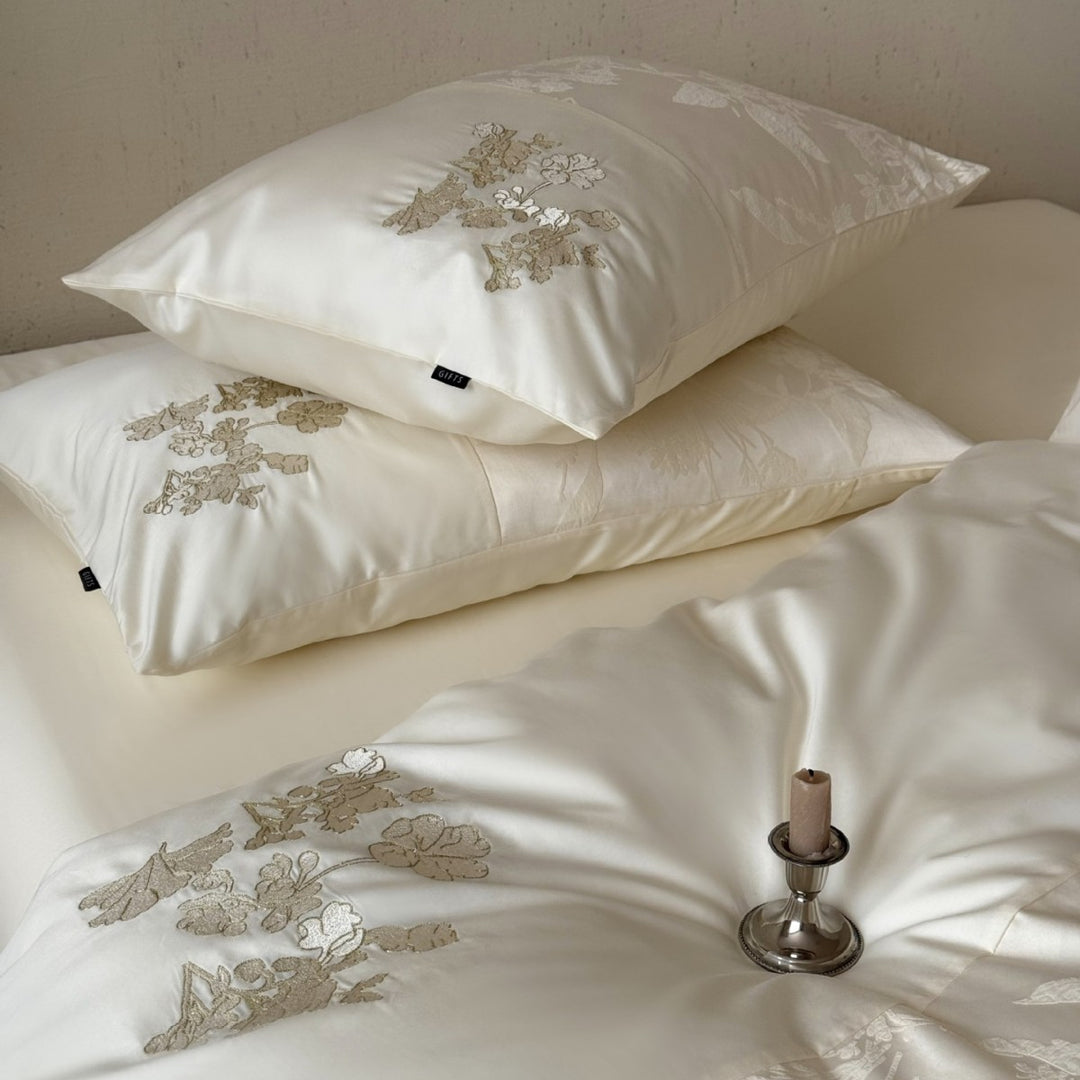 Silky satin bedding set with jacquard relief, floral embroidery, and ruffle
