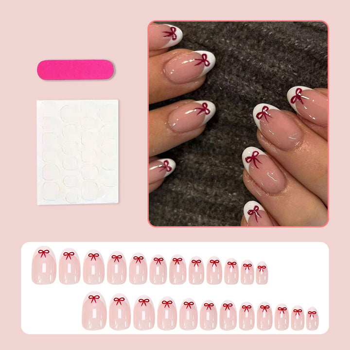 Artificial nail set with romantic bow motifs and French design Stornfield