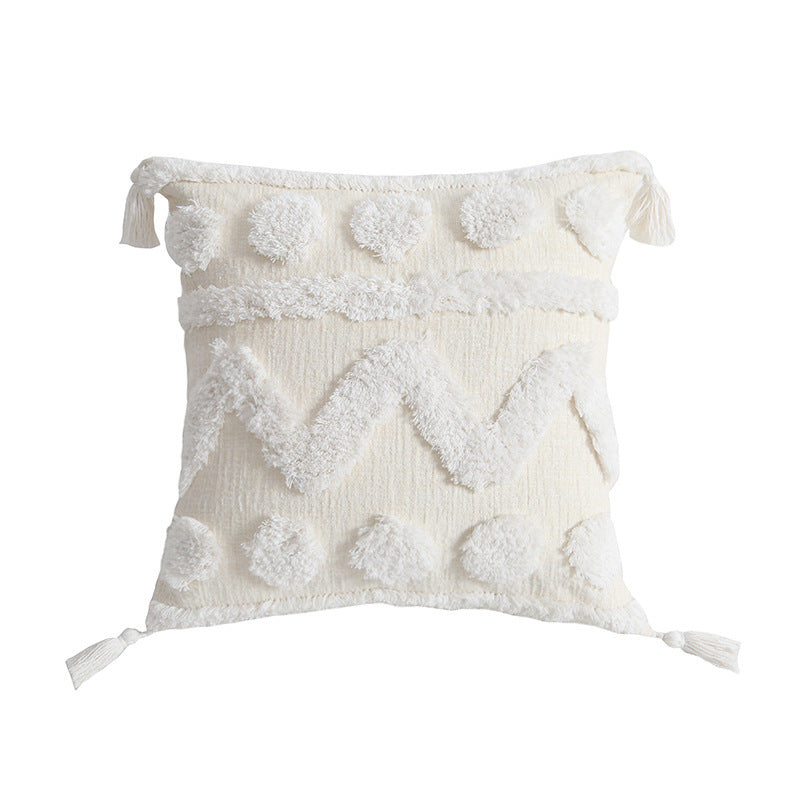 Rectangular decorative cushion cover with hand-tufted chevron and pompom relief as well as corner tassels Stornfield
