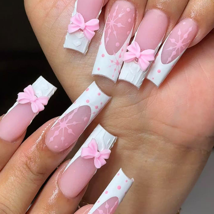 Artificial nail tips with playful bows and snowflake design Stornfield