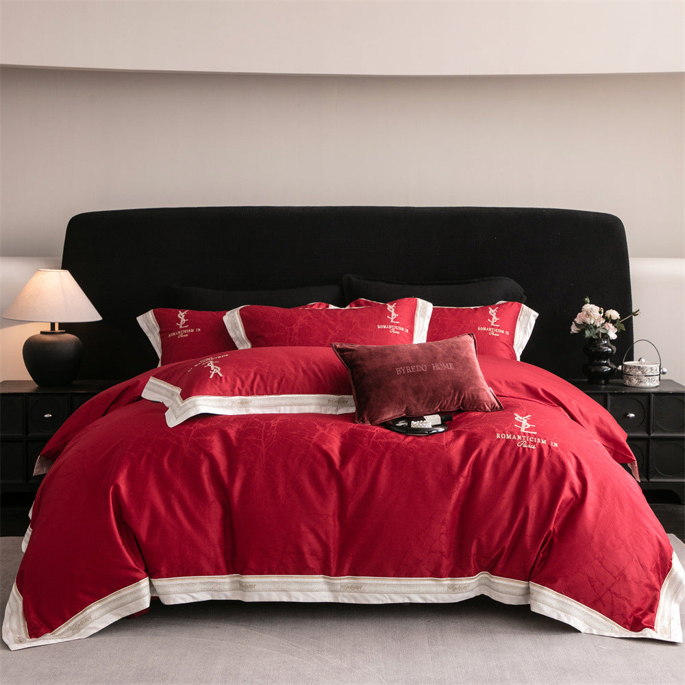 Luxurious satin bedding set with subtle marble texture and golden embroidered border