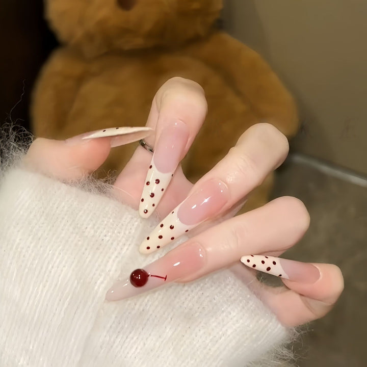 Artificial nails with playful design and cherry accents Stornfield