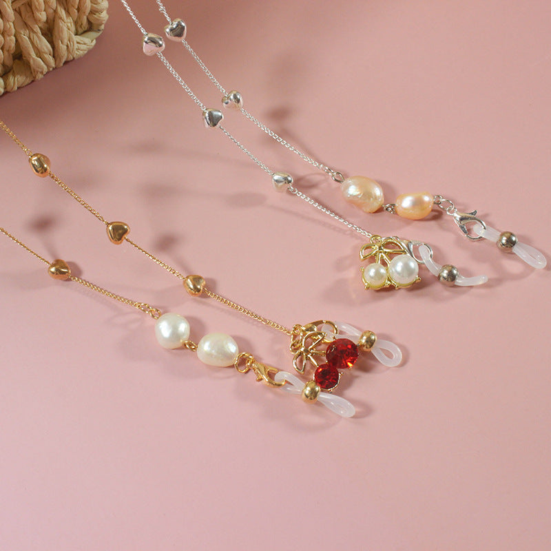 Elegant jewelry ribbon with pearls and silver accents Stornfield