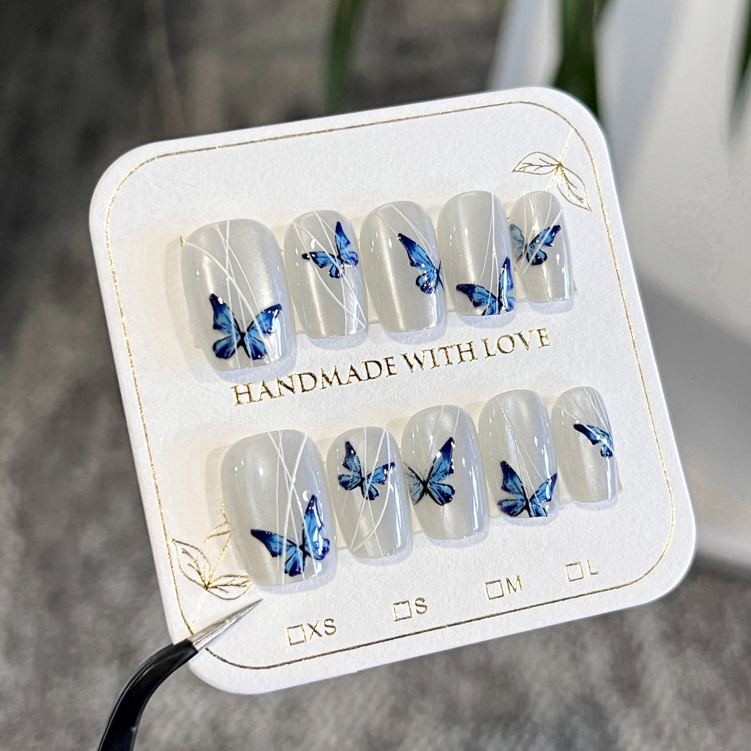 Creative nail extensions with intricate butterfly design Stornfield