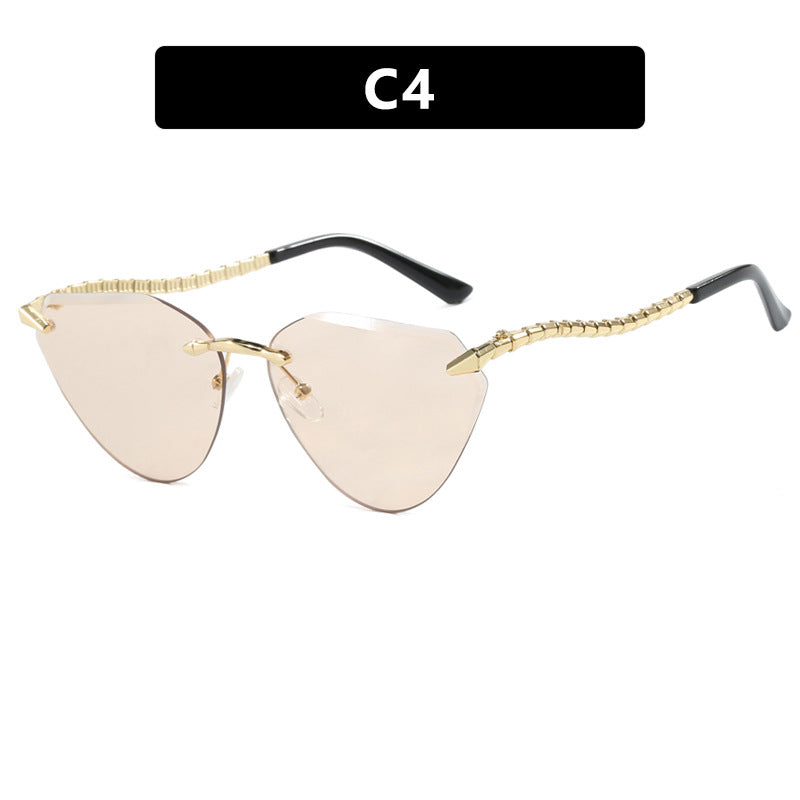 Women's Cat-Eye Sunglasses with unique gold frame design and protective lenses Stornfield