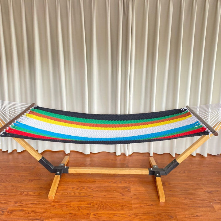 Woven cotton hammock with wooden spreader bars and freestanding stand Stornfield