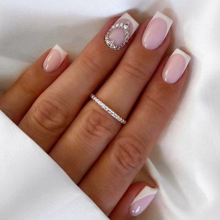 Artificial nail set with elegant French design and rhinestone embellishments Stornfield