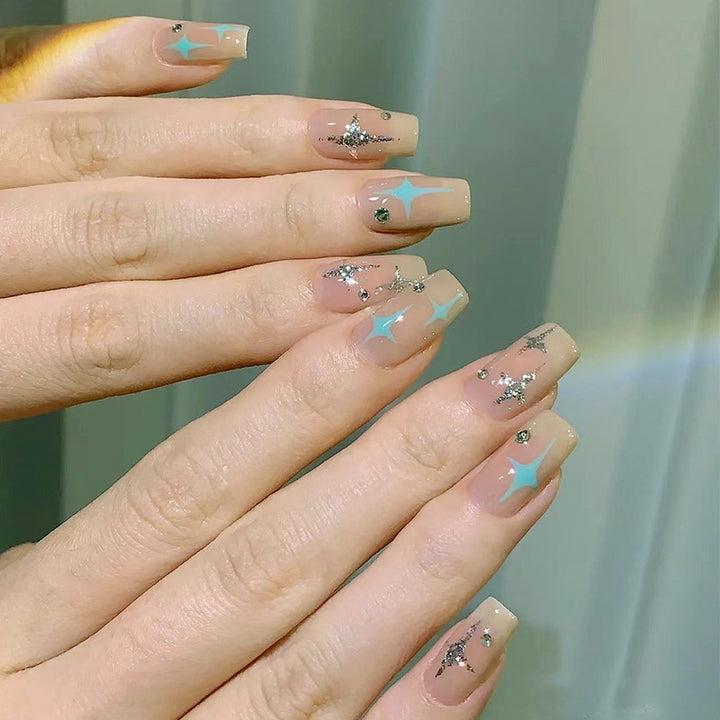 Acrylic nail set with sparkling star and glitter elements Stornfield