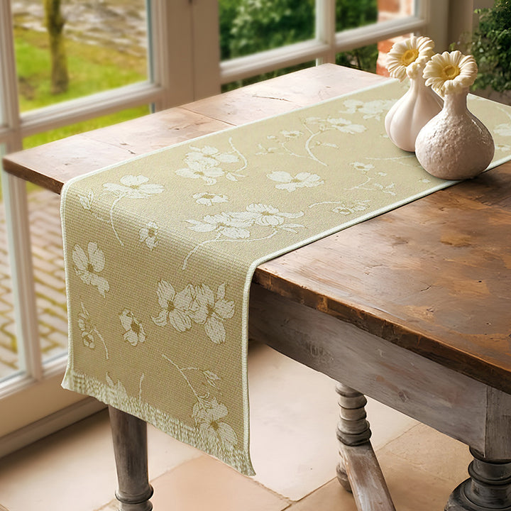 Woven table runner with floral jacquard pattern and fringed edge Stornfield