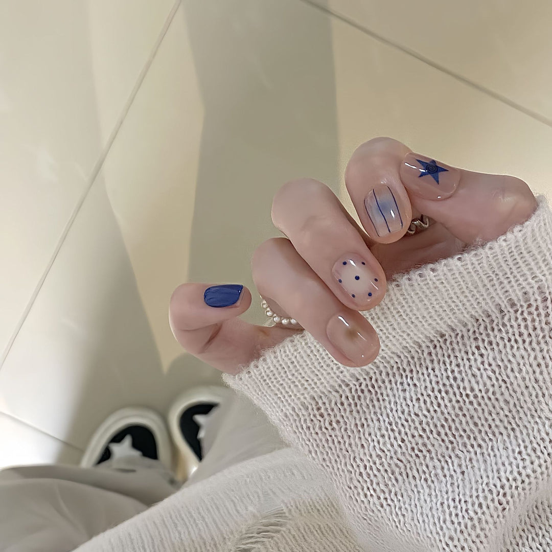 Artificial nails in modern design with geometric and sparkling accents Stornfield
