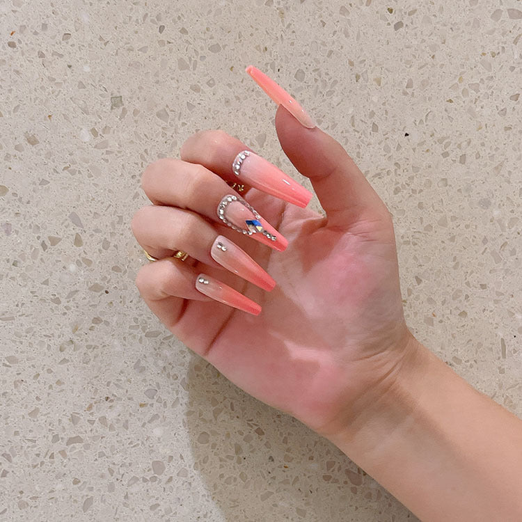 Artificial nails with glitter and stone embellishments Stornfield