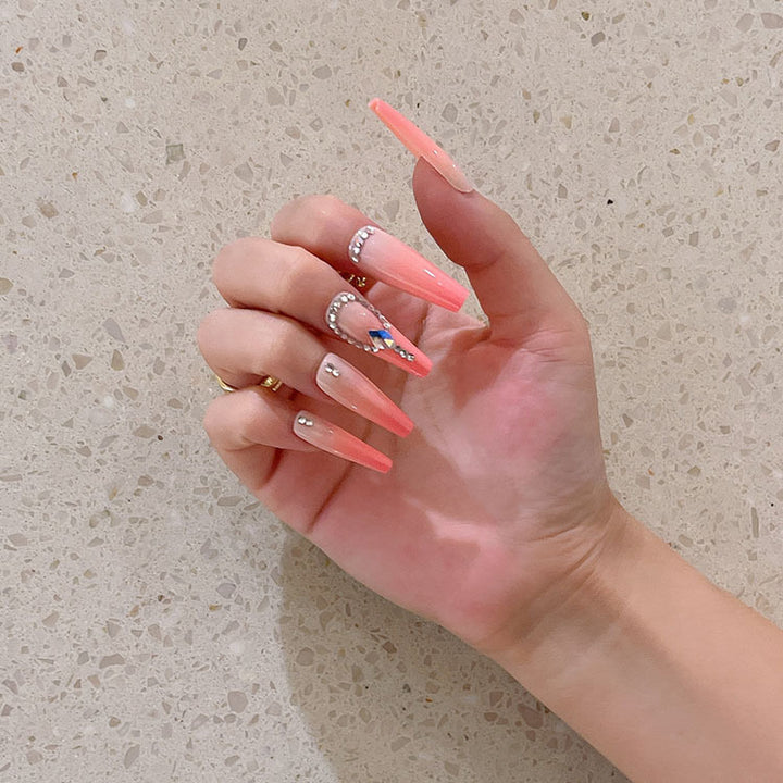 Artificial nails with glitter and stone embellishments Stornfield