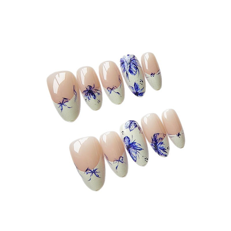 Artificial nails with floral pattern and elegant accents Stornfield