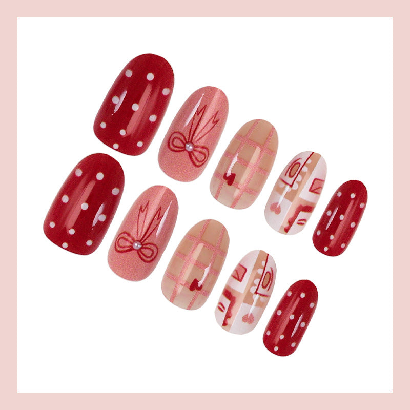 Artificial nail set with charming heart and bow patterns Stornfield