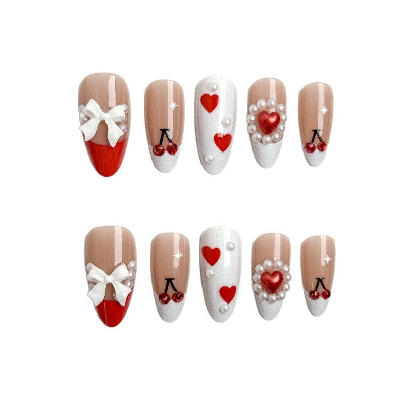 Creative nail art with heart and cherry motifs Stornfield