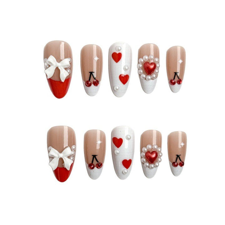Creative nail art with heart and cherry motifs Stornfield