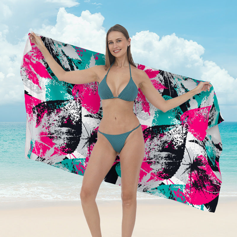 Beach towel with vibrant tropical plant motif Stornfield
