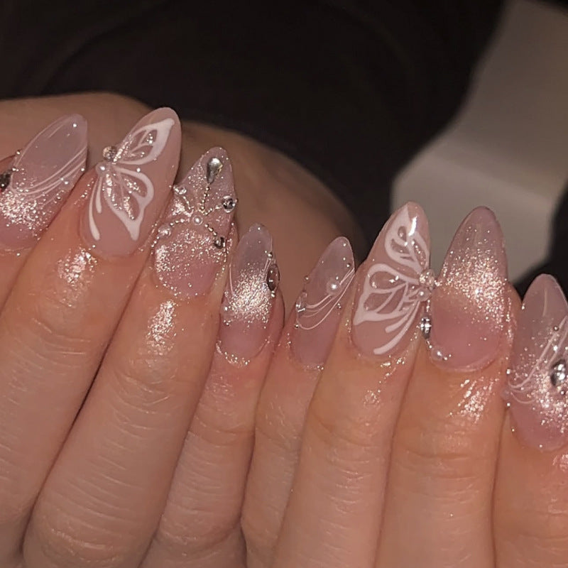 Artful nail extensions with delicate flower and glitter accents Stornfield