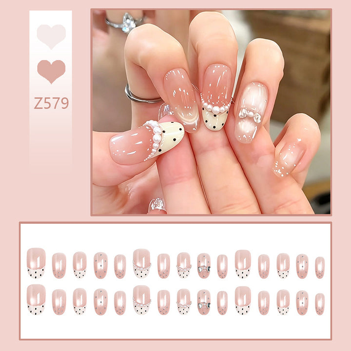 Artificial nail set with elegant French design and delicate pearl embellishments Stornfield