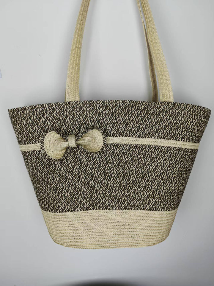 Elegant straw bag with decorative bow closure Stornfield