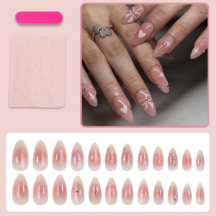 Artificial nail set with romantic heart and bow motifs Stornfield
