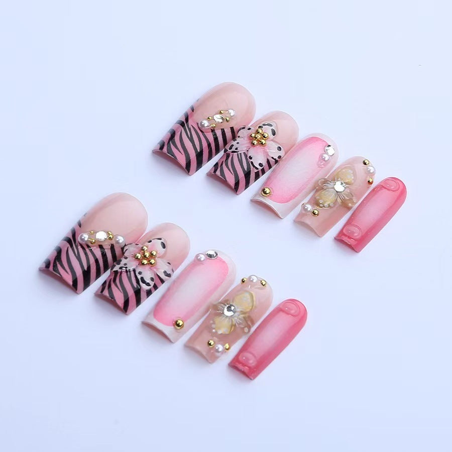 Artificial nail set with floral and glamorous decorations Stornfield
