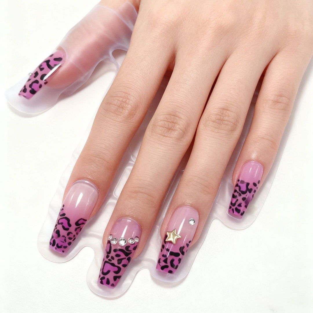 Artificial nails with leopard pattern and rhinestone details Stornfield
