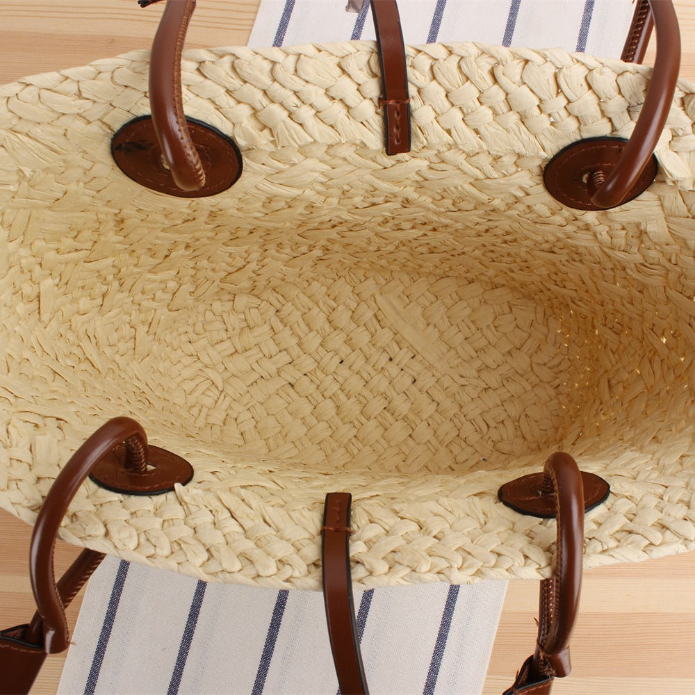 Beach bag made of high-quality braided straw with stylish leather handles Stornfield