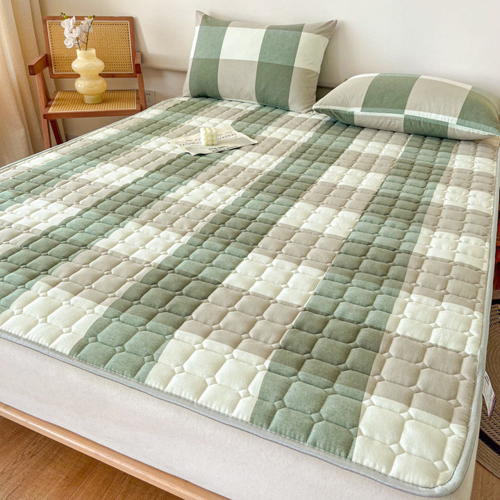 Padded mattress protector-topper with quilting and non-slip underside