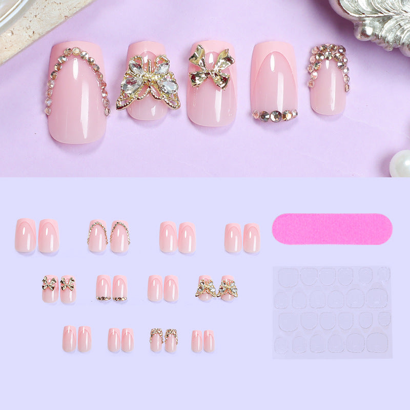 Glamorous artificial nail set with floral accents and glitter decorations Stornfield