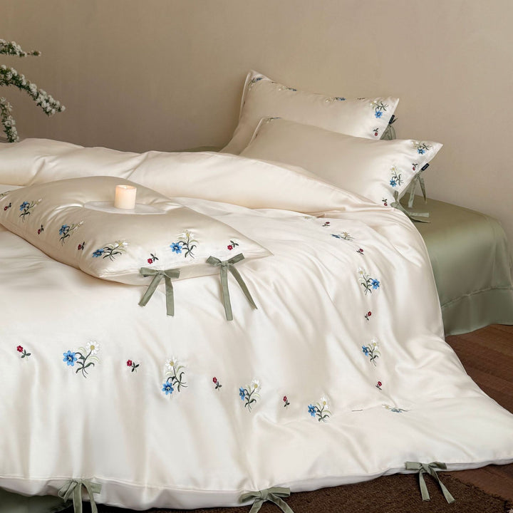 Luxurious satin bedding with floral embroidery and bow closure