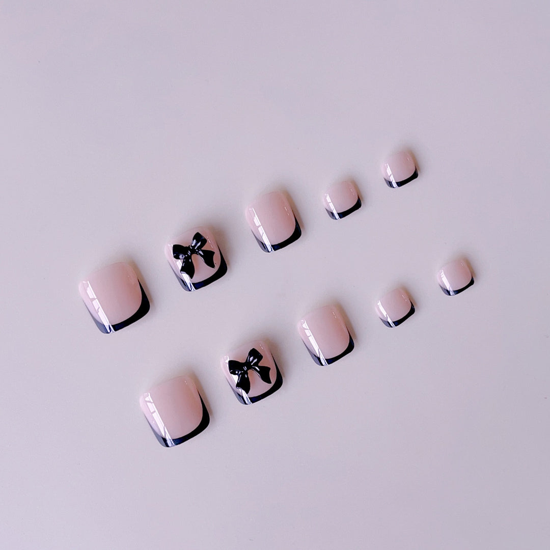 Artificial nail set with elegant bow accents Stornfield