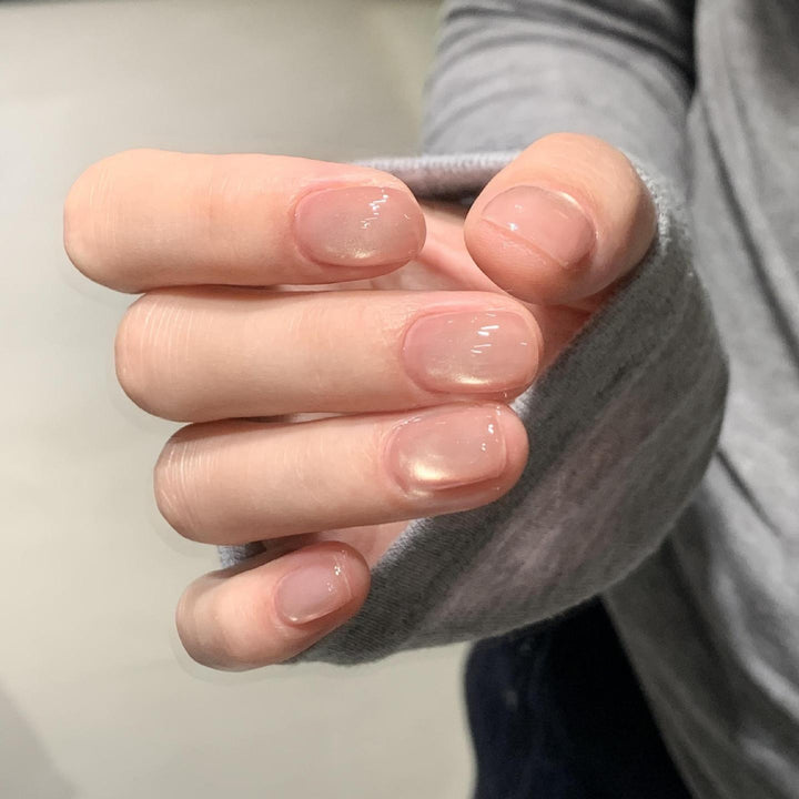 Shiny artificial nails with natural effect Stornfield
