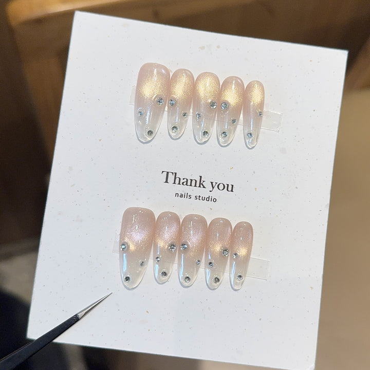 Artificial nails with shimmering accents and elegant rhinestone details Stornfield